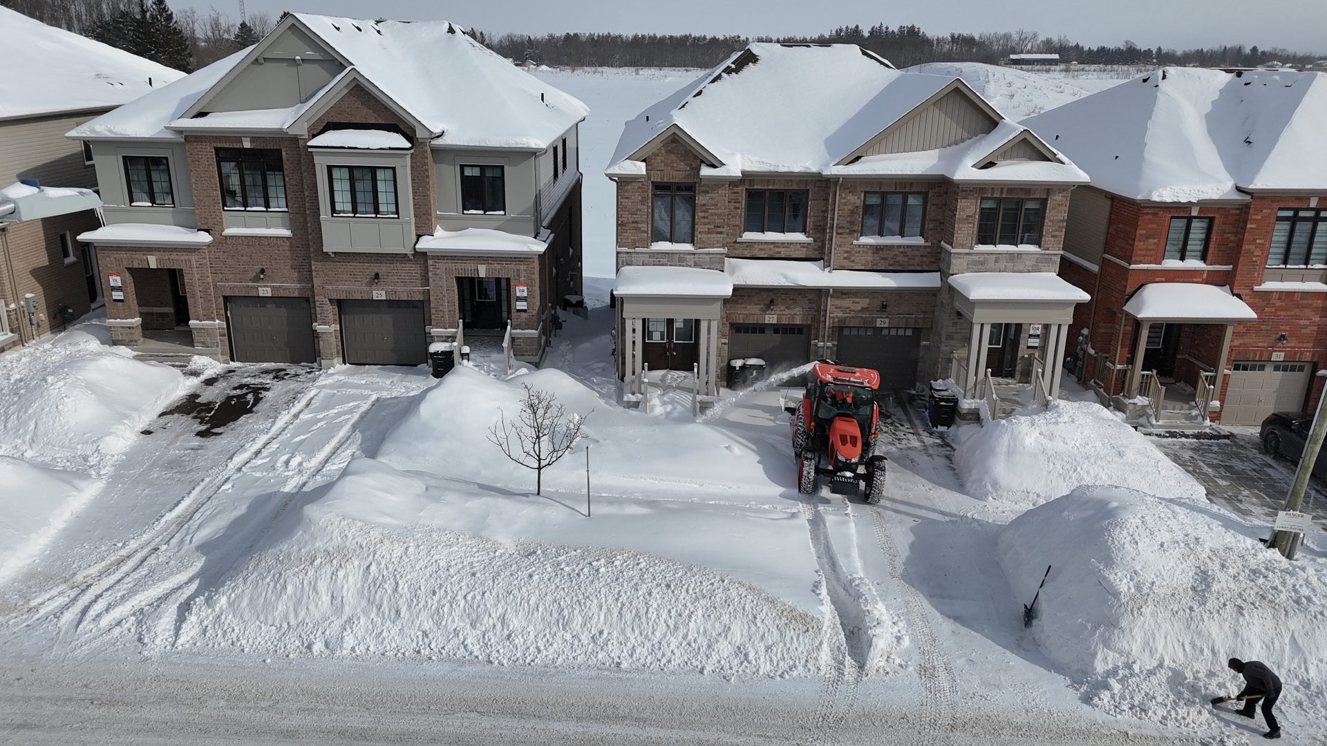Aerial shot of a freshly cleared driveway after a snowstorm